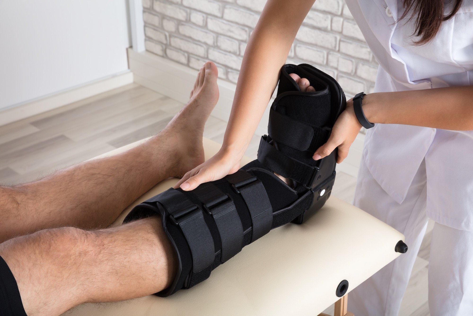 Man Trying on Foot and Ankle Brace