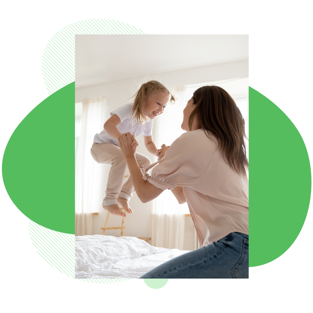 girl-and-mother-playing-indoors-on-bed_vert__afd-abstract-blurbs-12