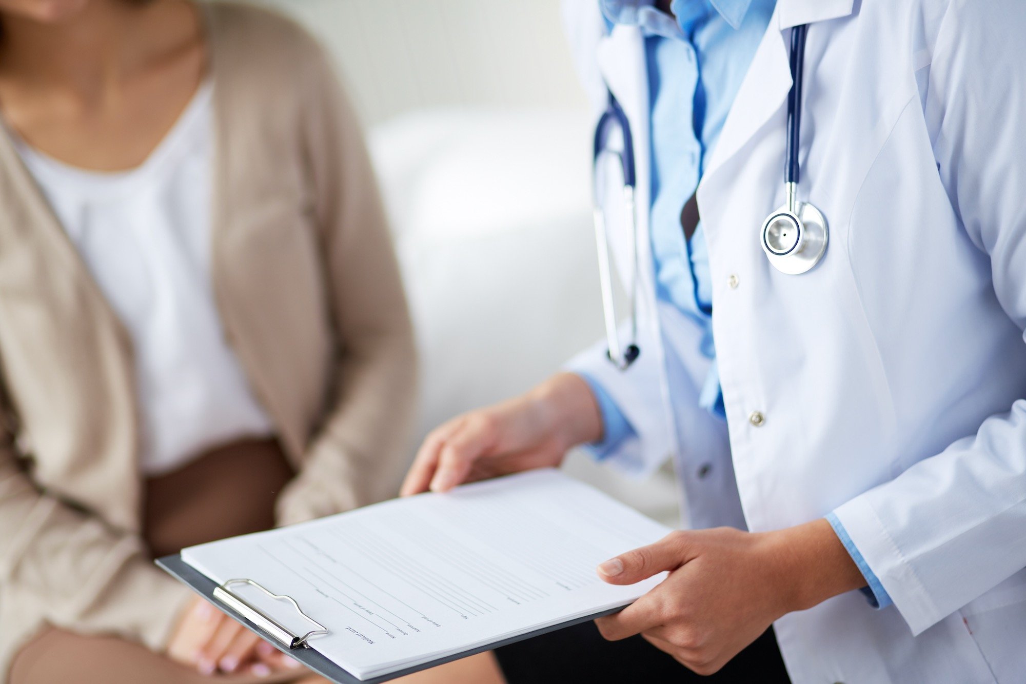 Podiatrist Reviewing Patient Chart