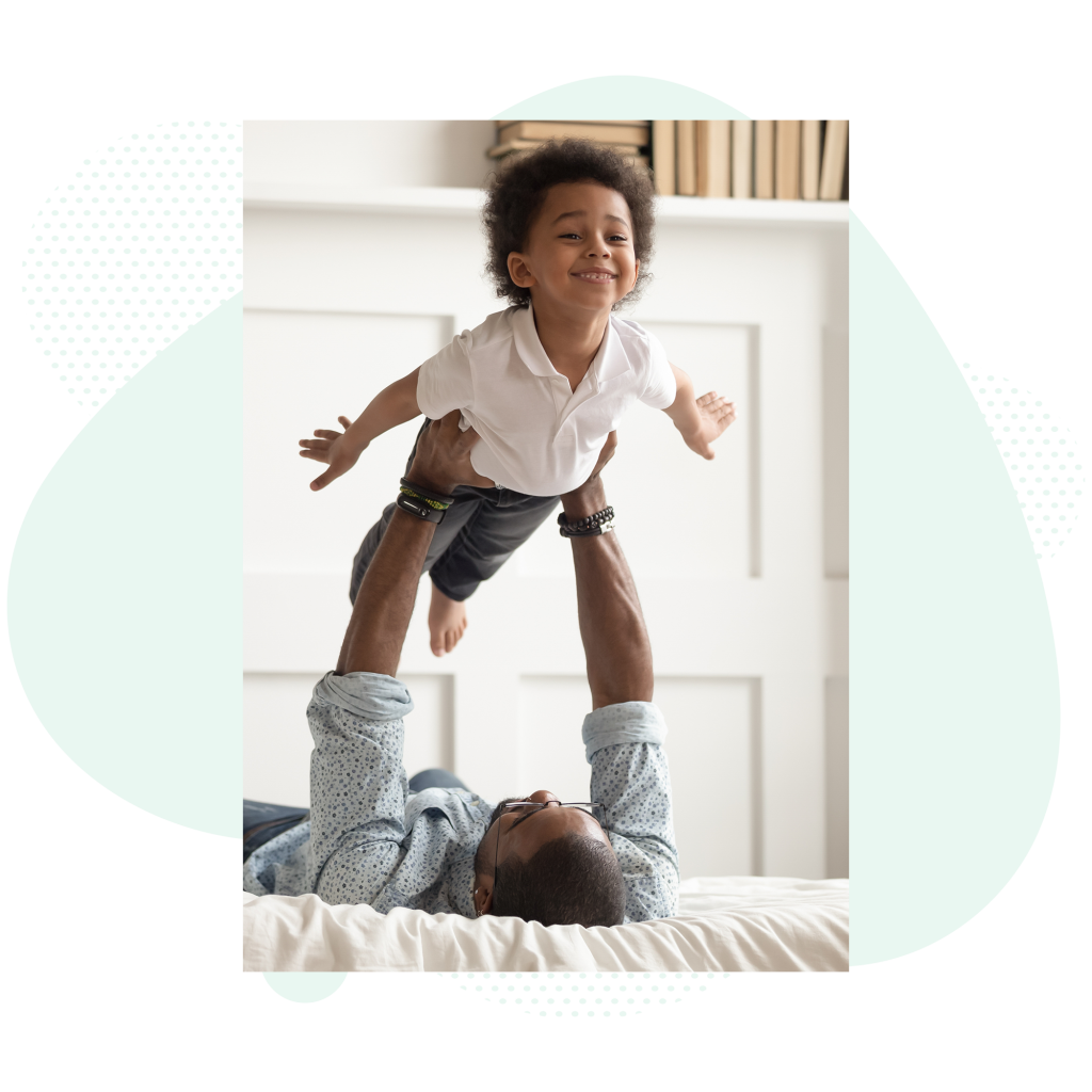young-boy-and-father-playing-airplane-at-home_vert__afd-abstract-blurbs-12