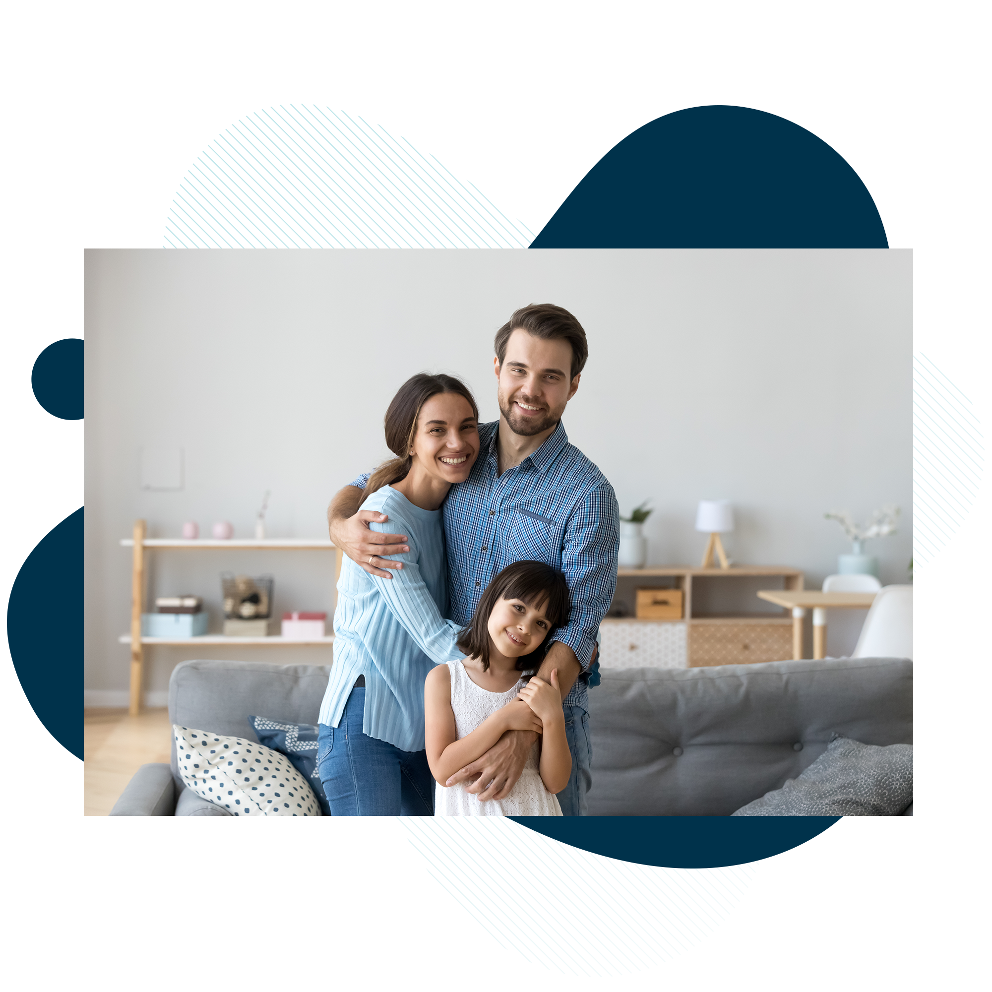 Young family hugging in living room