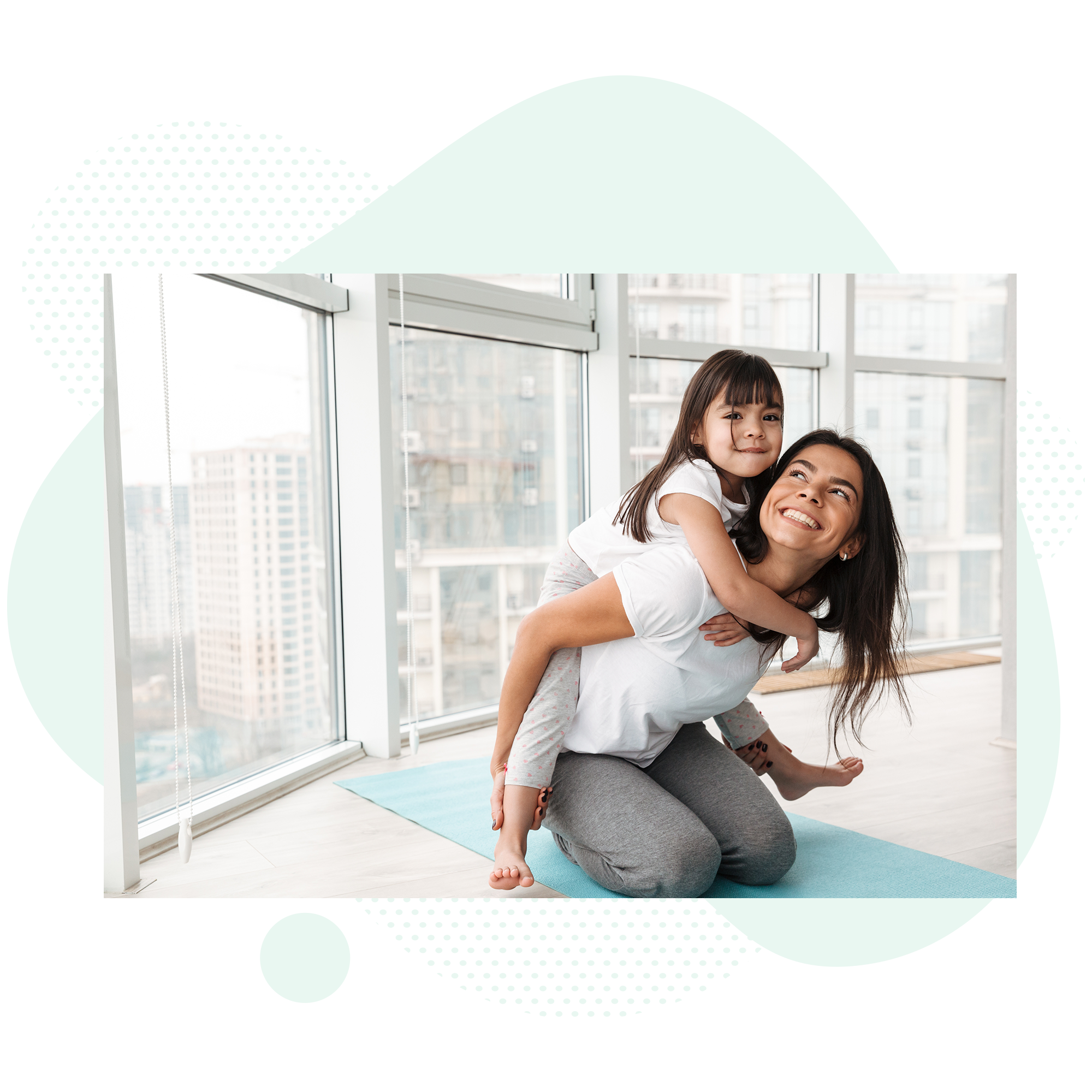 Mother with daughter on her back doing yoga