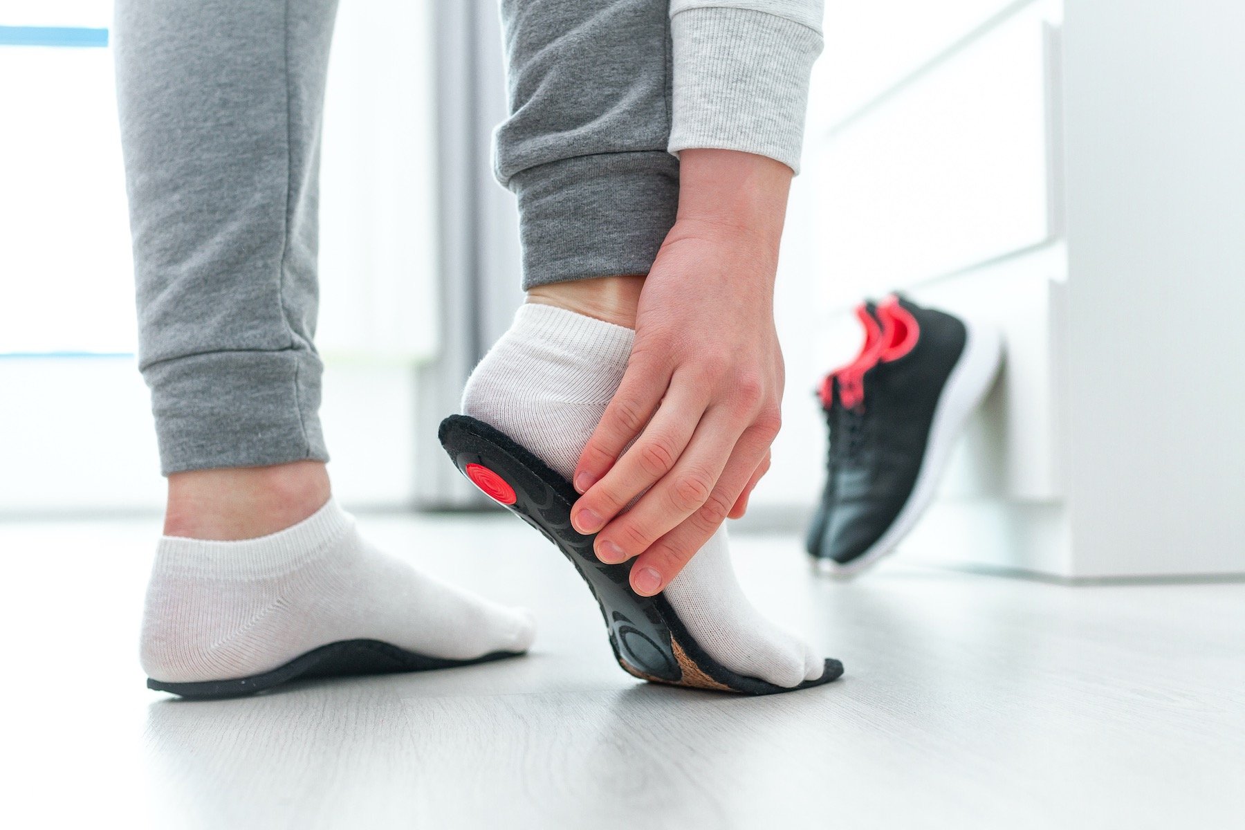Woman Wearing Orthotics to Treat Foot Pain That's Not Plantar Fasciitis